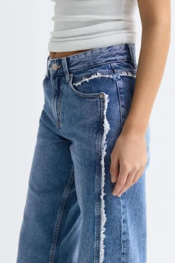 Fringe seam jeans