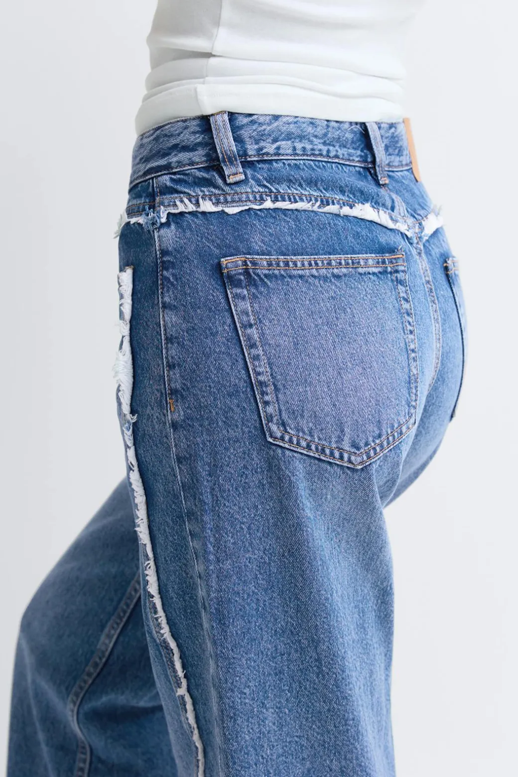Fringe seam jeans