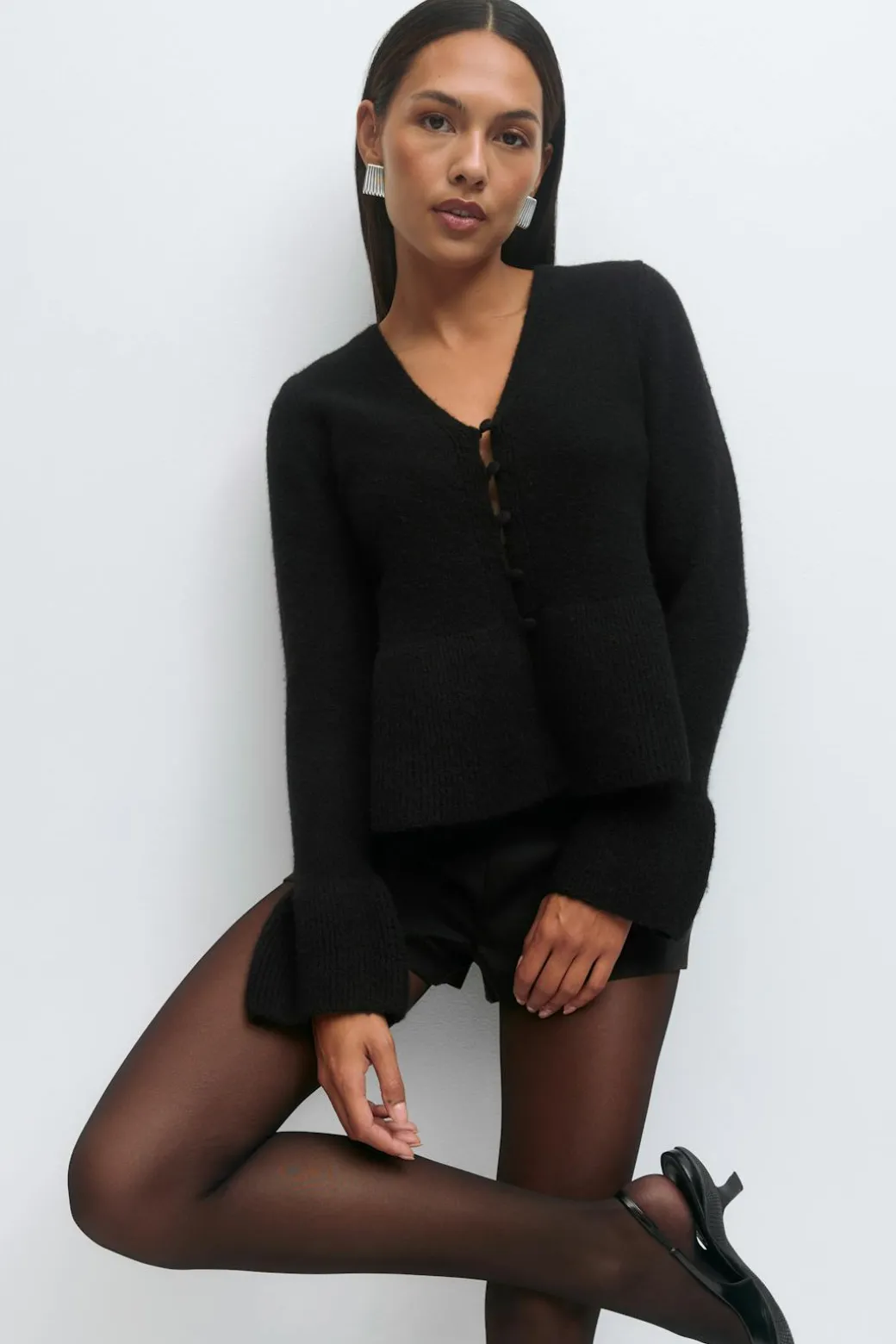 Knitted peplum cardigan