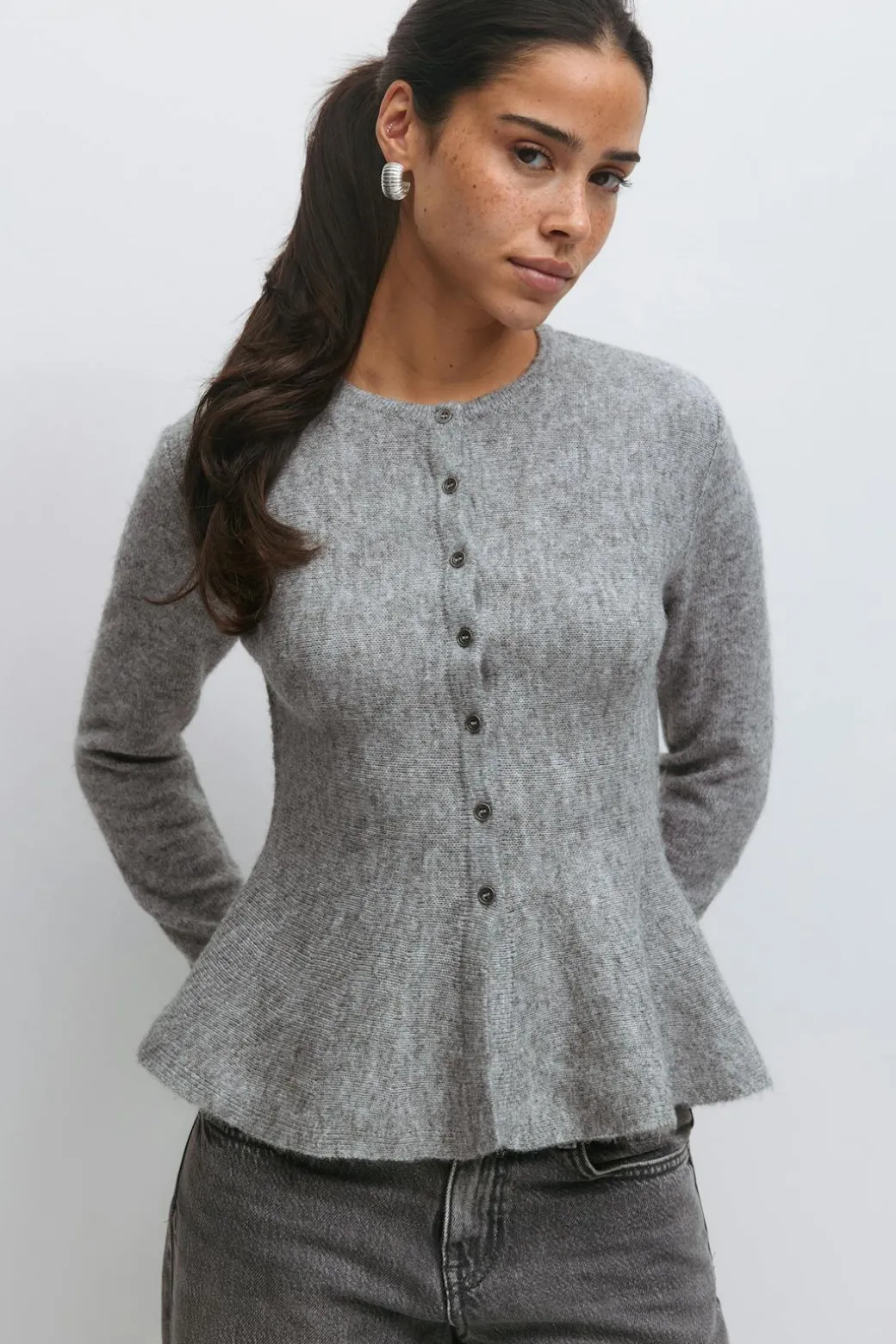 Knitted peplum cardigan
