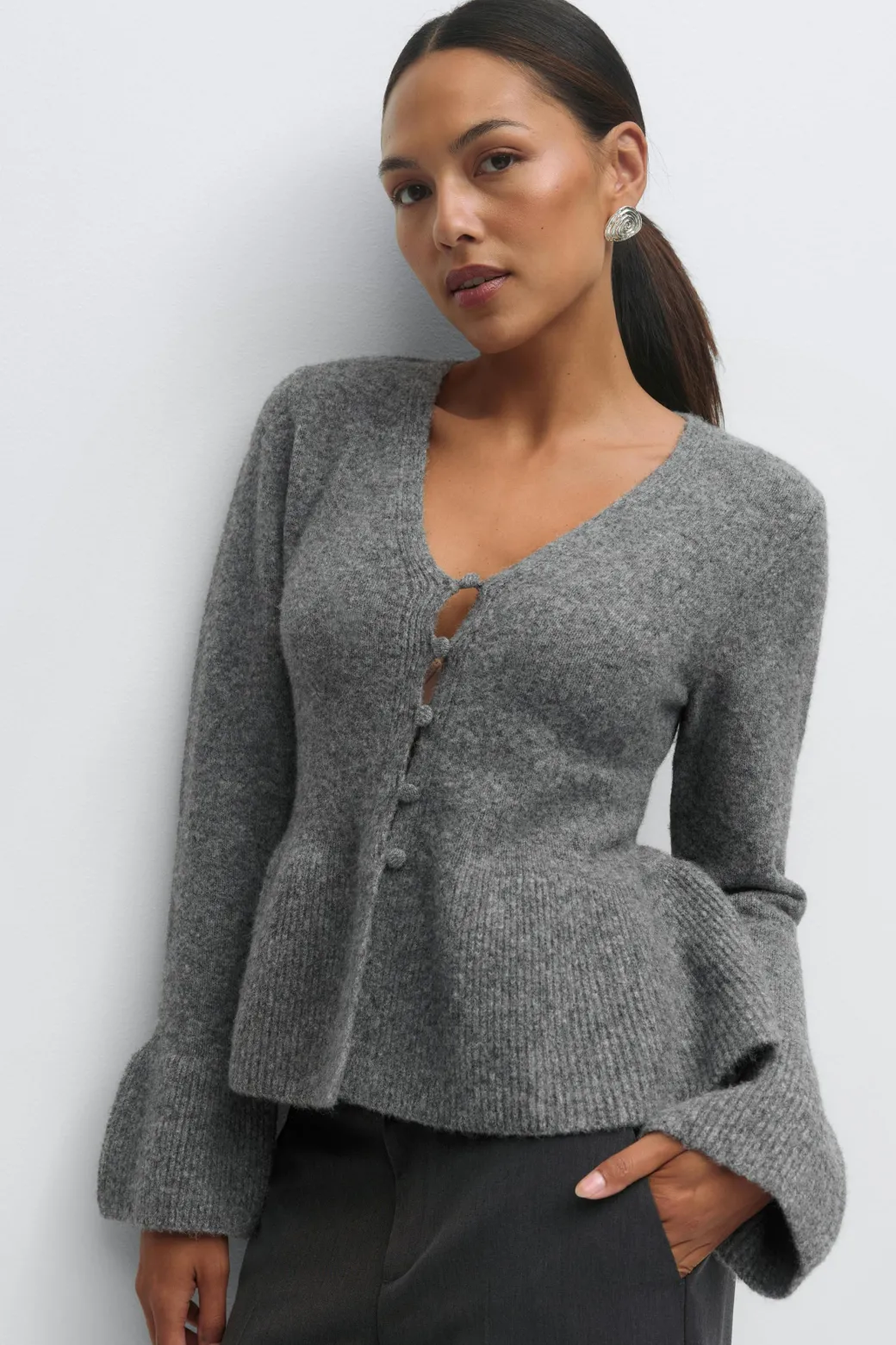 Knitted peplum cardigan