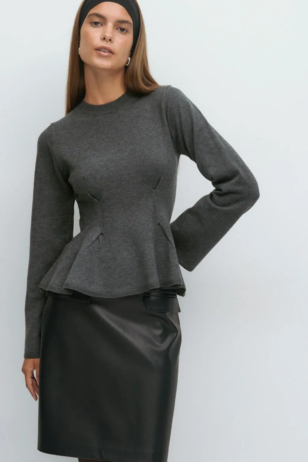 Knitted peplum top
