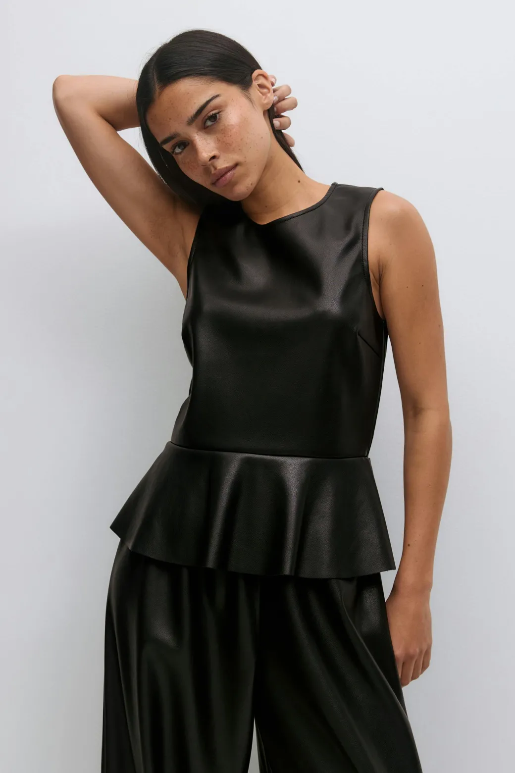 Pu peplum top