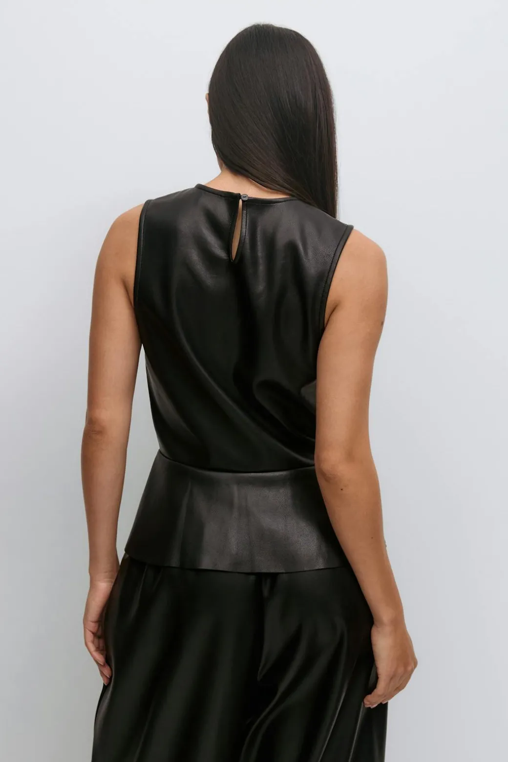 Pu peplum top