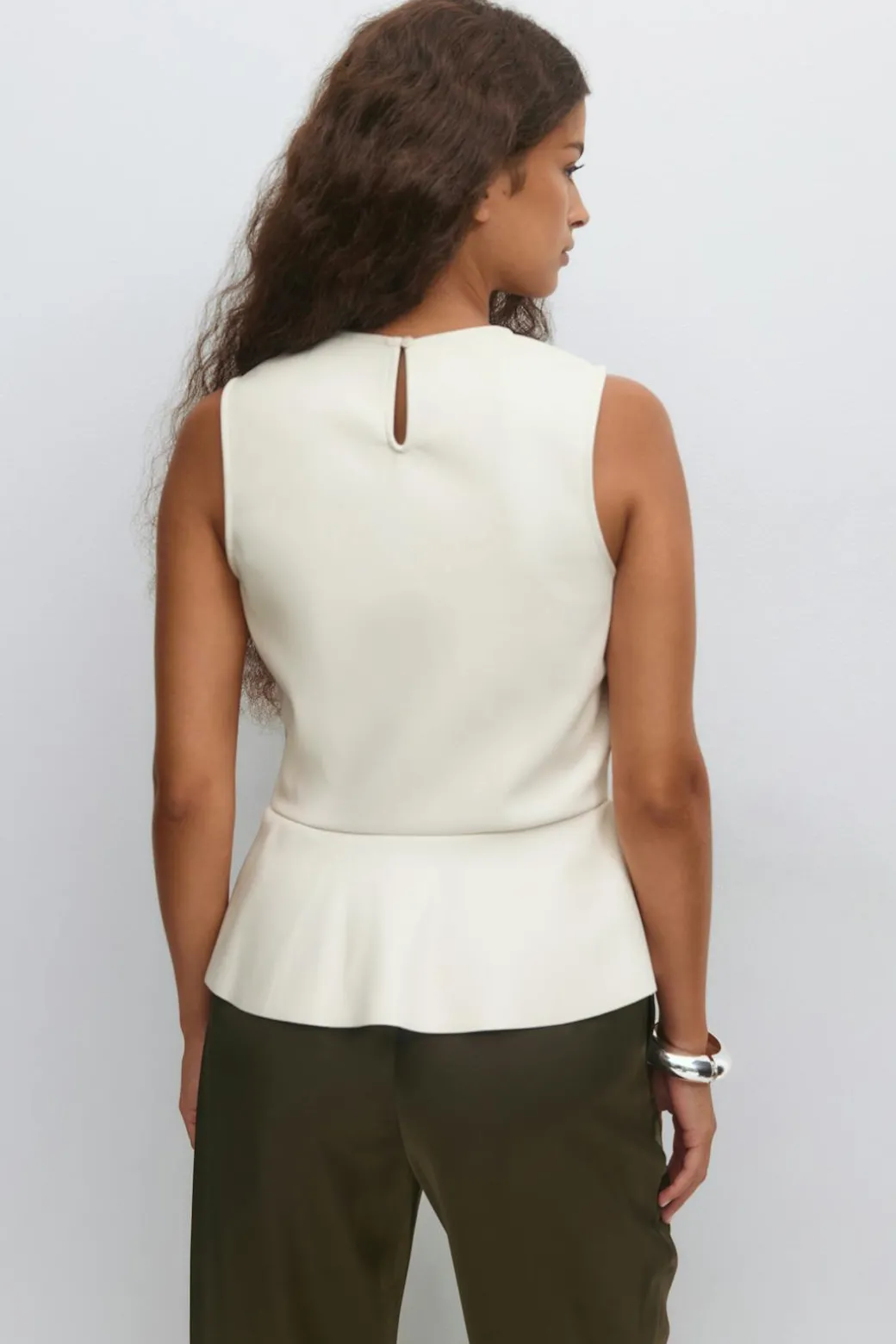 Pu peplum top