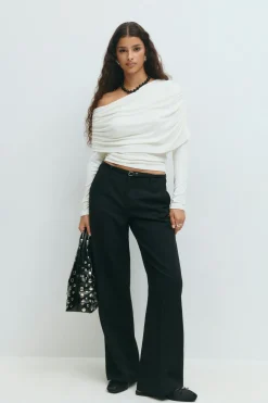 Sloped shoulder cape top