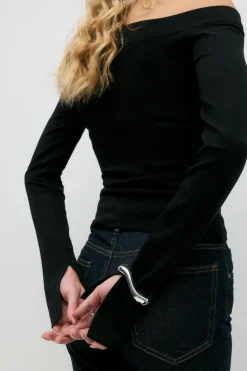 Sloped shoulder top