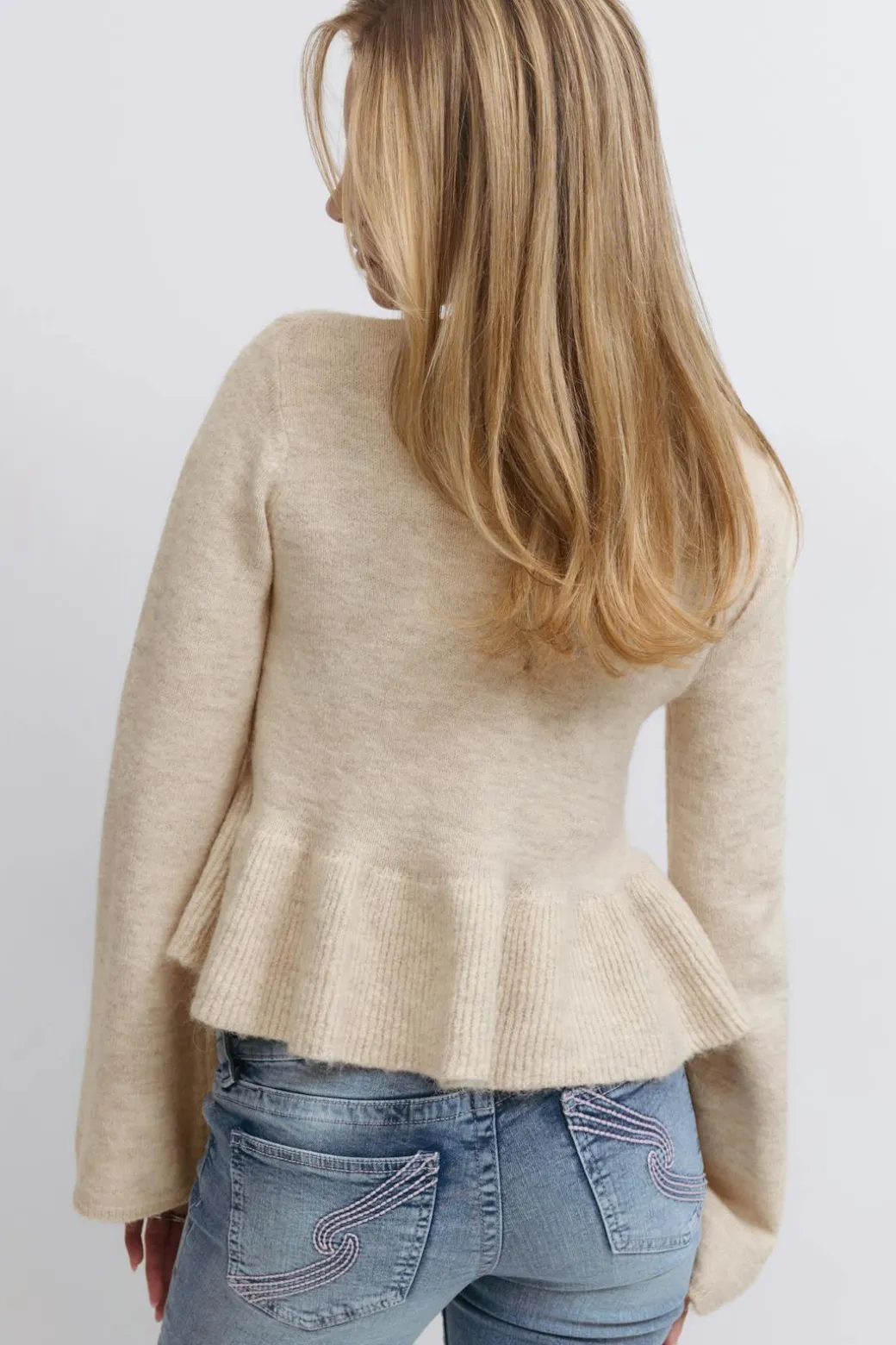 Y knitted peplum sweater